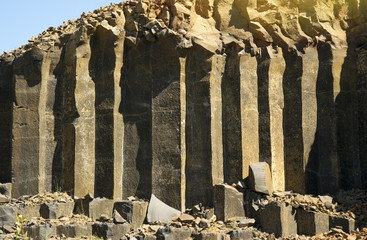 Ancient basalt pillars left after the extinct volcano. Textured stones are created by nature.