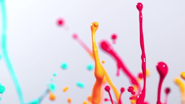 Colorful splashing paint in super slow motion. Shot with high speed cinema camera, 2000fps
