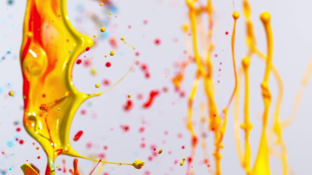 Colorful splashing paint in super slow motion. Shot with high speed cinema camera, 2000fps