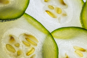 slices of zucchini on a white background