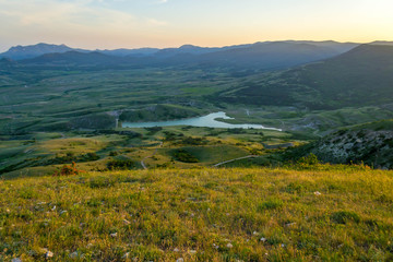 Naklejka premium Green meadows and mountains