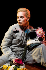 fashionable female astronaut in spacesuit with flowers and helmet © LIGHTFIELD STUDIOS