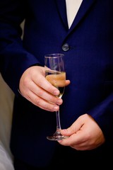 Men's hands with a glass