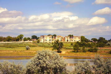 Obraz premium ruins of the manor, lake and trees