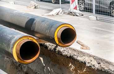 District heating insulated pipes pipeline reparation and reconstruction parallel with the street...