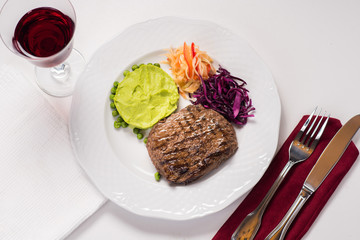 Meat steak dish with mashed potatoes