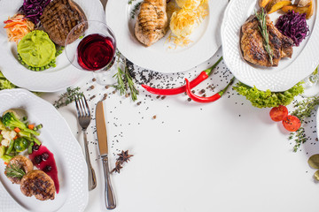 Different meat dishes with vegetables and spices. Top view. Flatlay. Copy space