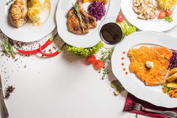 Different meat dishes with vegetables and spices. Top view. Flatlay. Copy space