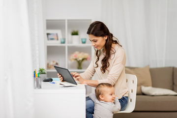 multi-tasking, education, motherhood and technology concept - happy mother student with baby and...