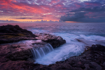 Fototapeta na wymiar Pink sunset at Pointe des Chateaux in Saint Leu, Reunion Island