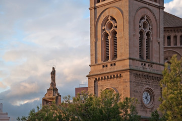 Naklejka premium PALMA DE MALLORCA, SPAIN - NOVEMBER 15, 2011: Church with tower and Holy Mary statue in Santa Catalina on November 15, 2011 in Palma de Mallorca, Spain