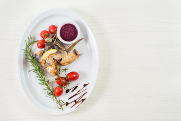 roasted fish with head and vegetables