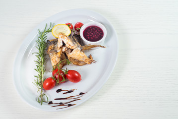 roasted fish with head and vegetables