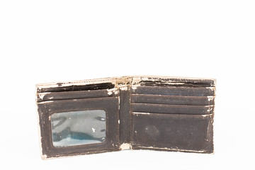 An isolated photo of an old brown leather wallet.  - Powered by Adobe