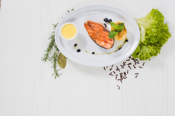 Fried salmon steak with lemon sauce