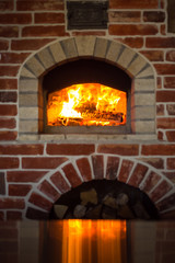 Traditional italian Pizza oven, burning wood and flames in fireplace