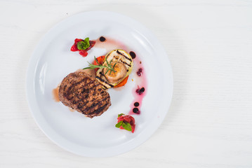 Grilled meat steak dish with fruits garnish