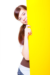 Teenage woman / girl hiding behind a board
