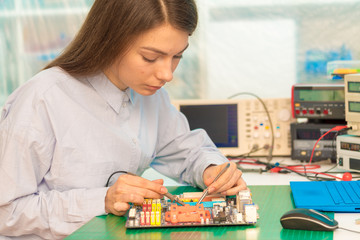Fototapeta premium girl student in the class physics and electronics
