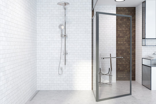 Shower in a white brick bathroom