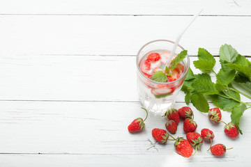 Strawberry detox water with mint, antioxidant gourmet in glass.