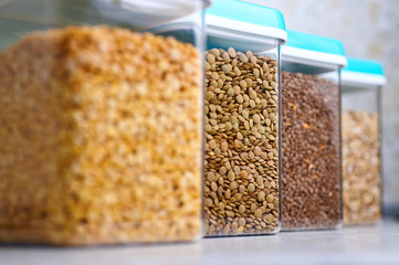 groats in glass jars in modern kitchen
