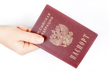 Hand gives a Russian passport on white background