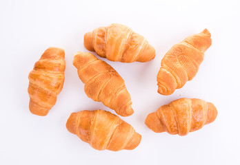Top view of fresh croissants isolated over white background