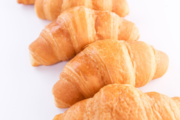 Fresh croissants isolated over white background