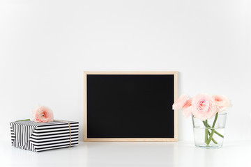 Composition with chalkboard, pink ranunculus with gift paper box. Landscape mockup