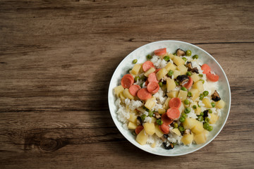 Wooden background and cooked rice