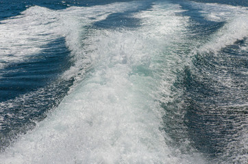 Sea waves splashing, yacht track