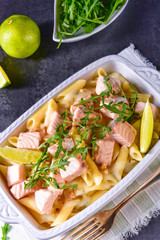 Salmon with penne noodle and arugula