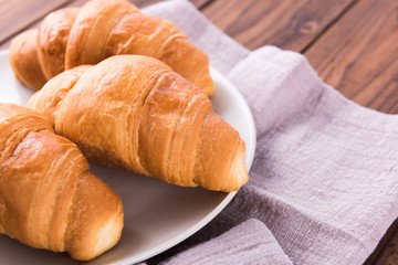 Freshly baked butter croissant. Closeup