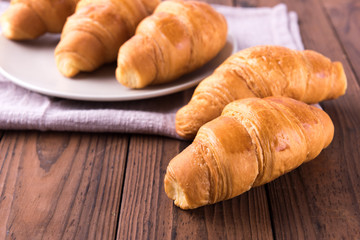 Freshly baked butter croissant. Closeup