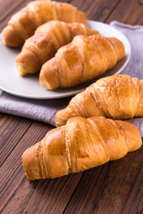 Freshly baked butter croissant. Closeup