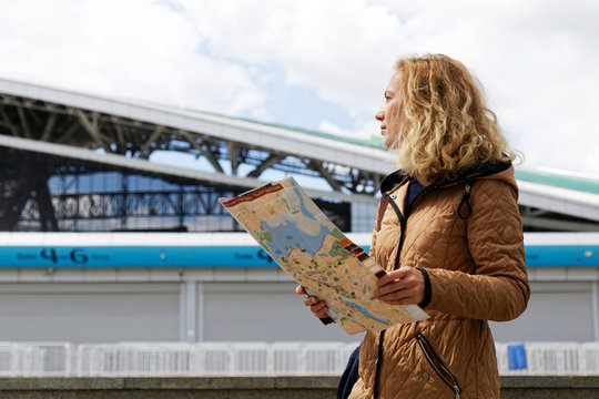 Woman tourist holding a tourist map of Kazan.