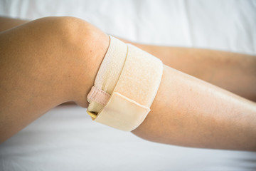 Women use knee supporter to prevent injuries.