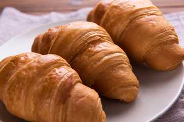 Freshly baked butter croissant. Closeup