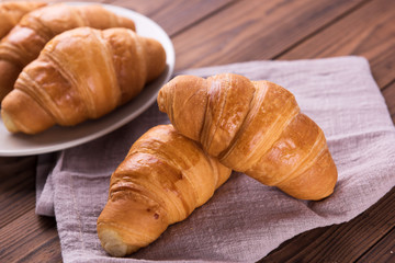 Freshly baked butter croissant. Closeup