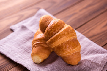 Freshly baked butter croissant. Closeup