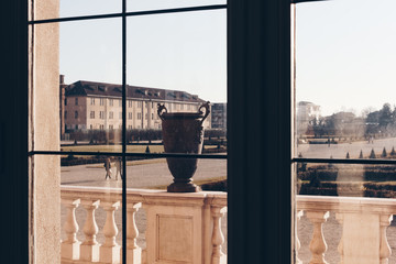 looking from a window in a luxury villa with old vase somewhere in italy