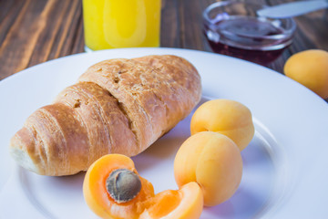 croissant and apricots, light breakfast