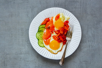 Breakfast with salmon and fried eggs