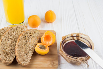 light breakfast - fresh bread, apricot, jam and juice
