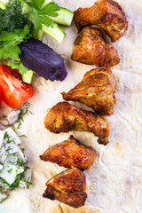 Russian shish kebab, close-up, pita bread and vegetables
