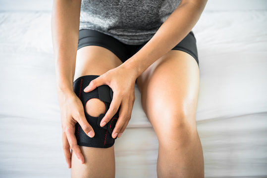 Women use knee supporter to prevent injuries.