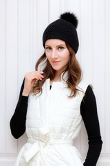 Hipster Style Brunette Girl Swag wearing Black fashion beanie knitted hat with bumbon pumpon....