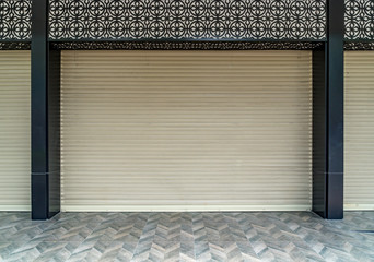 Old beige roller shutter door