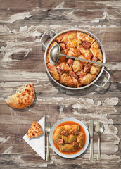 Traditional gourmet pickled Cabbage rolls with leavened flatbread served on old rustic weathered cracked flaky garden table